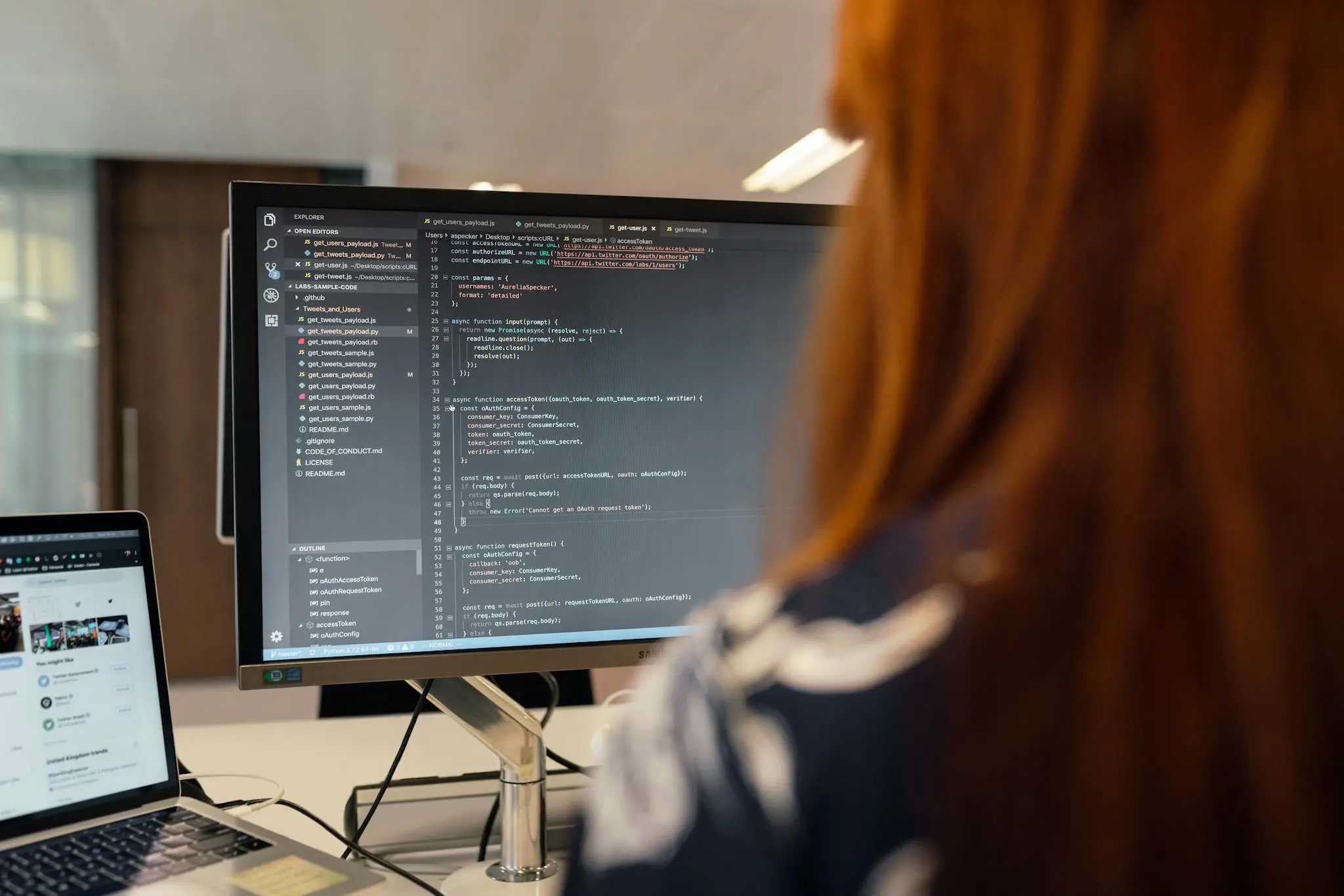 a woman coding on a computer screen